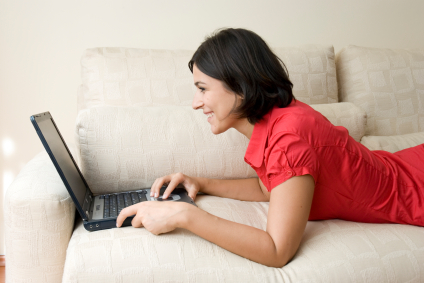 Woman Reading From Laptop